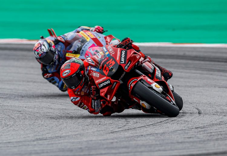 LeNovo Ducati’s World Championship points leader Francesco “Pecco” Bagnaia is pictured leading his 2023 team-mate, current Gresini Ducati rising star Enea Bastianini -will they stay this close this weekend with the title on the line? CREDIT Ducati Media House